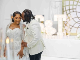 Nigerian Wedding Photography in London | Lively Dance Floor Bride and groom at Nigerian wedding dancing with guests under colorful lights