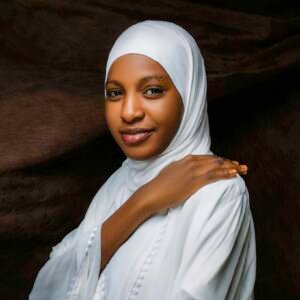 Graceful portrait of a woman wearing a white hijab, promoting cultural elegance and diversity.