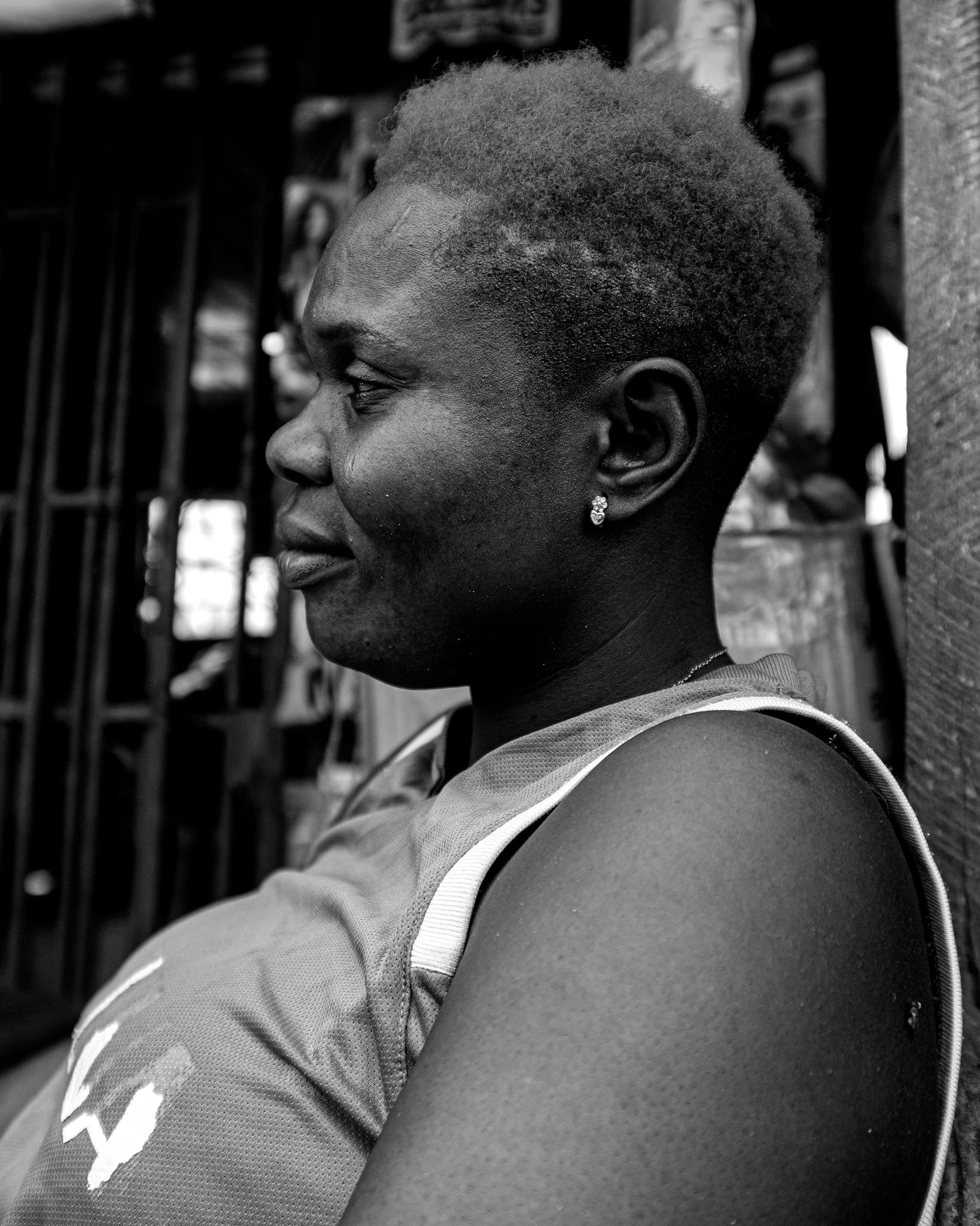 Side view black and white portrait of an African woman with short hair, taken in Nigeria.